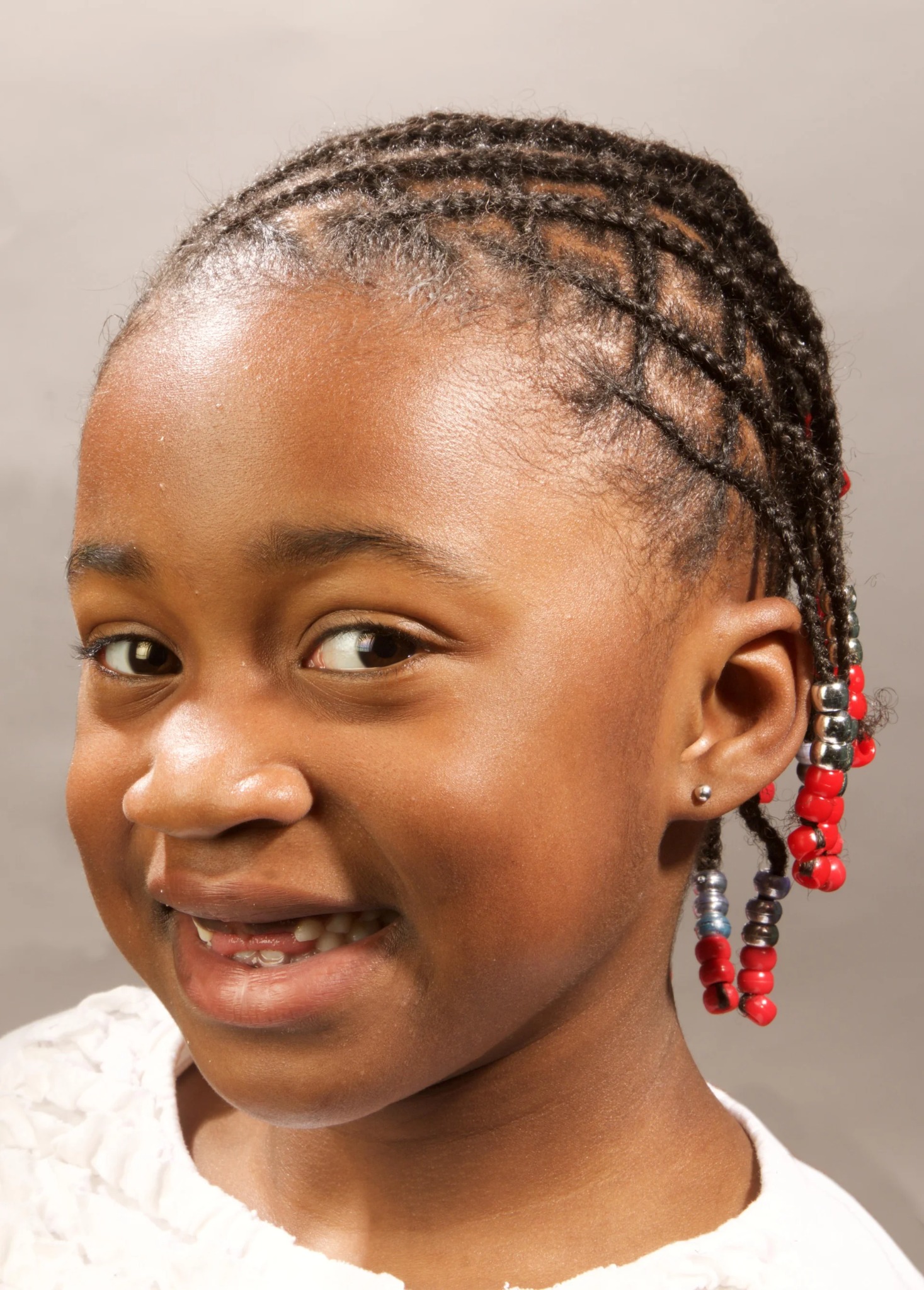 Children's custom braided style finished with red and silver beads